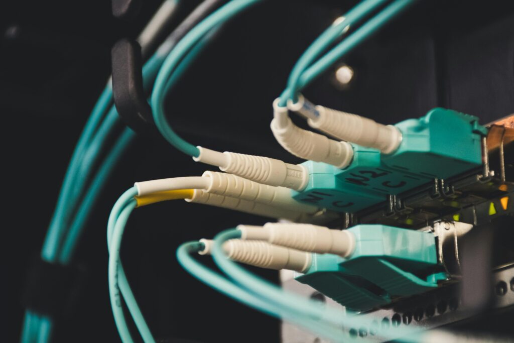 Fibre optic cables connected to network switch for high-speed data transfer